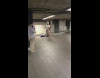 Woman white shirt sing at train station