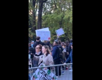 People hold and raise funny marathon signs