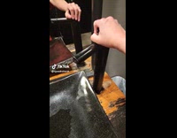 Woman in bathroom struggles to open faucet