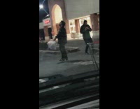 Man with two plastic bags on a music video shoot