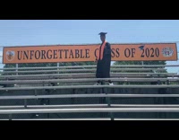 Guy graduation gown bleachers throws cap up