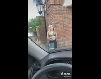 Girl sets phone car windshield starbucks drink 