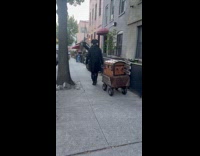 Man wearing pirate costume with treasure chest