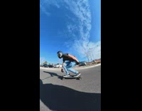 POV video of skateboarder running over pigeon bird on road