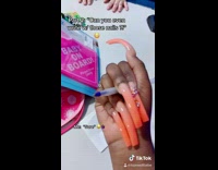 Girl with long acrylic nails writes jewell 