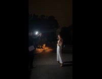 Collab IITW - Woman tiktok dance front of fountain lights