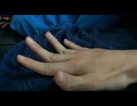 Lady on Bed Bends her Flexible Fingers 