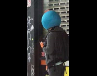 Round blue costume mask small orange mohawk 