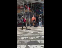 Guy Crosses Street Wearing Red Ski Mask 