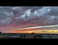 Sunset after storm grey clouds orange sky