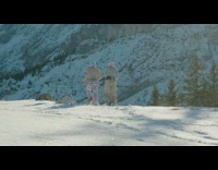 Woman in blue beanie mask finger gun pose