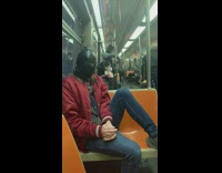 man with black leather face mask train