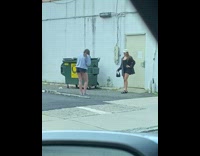 Black bodysuit white hat girl green dumpster