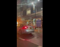 Car Hood Burns Hot and Bright at Street