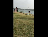 Black bikini bottoms hat girl squats water