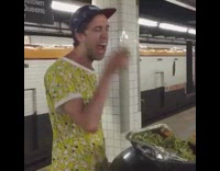Guy eats food from black trash can 