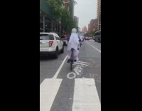 Four people ride blue bicycle white helmet 