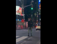 Man wear earphones dance on crosswalk night