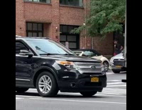 Woman in dress coat come and forth at the sidewalk