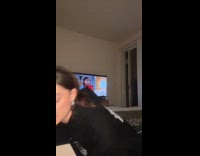 [third party] Woman struggles to put sweater on her dog 