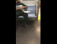 Guy eats bag of clams mussels with bare hands on subway train