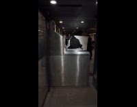 Guy try to bring huge canvas into turnstile