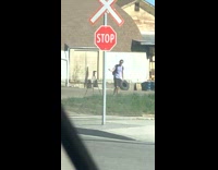 Man with backpack rap video tripod railroad