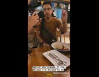 Guy spins fork into food and retakes shot for video camera