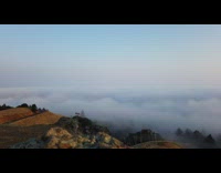 Timelapse panorama mountain summit sea of clouds