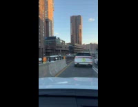 White car drives with license plate covered