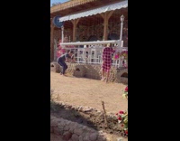 Woman in red checkered dress mocked by another woman