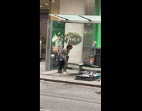 Woman pulls down pants and goes poop inside black trash bag at bus stop