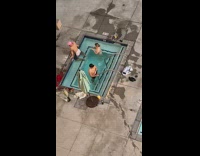 Man flexes his briefs in the mini pool