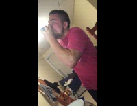 guy canada shirt shotgunning beer and putting container on friends head 