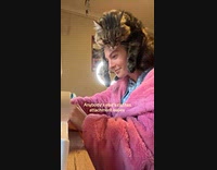 Cat on girls head sewing