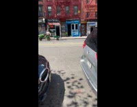 Collab WINY - Man drive green tractor pull wheelbarrow street