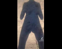 Guy moves butt cheeks shadow beach sand 