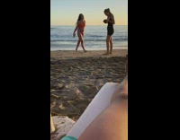 Girl poses with papaya on beach