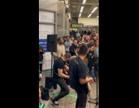 Old man joins band perform at station