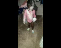 Little girl covered in baby powder 