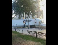 Big rig knocked over streetlight stuck in street 