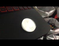 Coin makes strange sound spinning on laptop