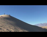 Collab Kook Of The Day - two people slide down sand dune fall at bottom