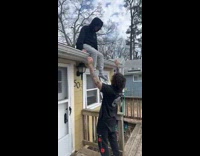 Guy doesnt catch friend jumping off roof