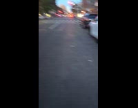 Man shows parked car with stolen tires