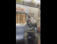 Random pigeon bird standing on top of head riding subway train
