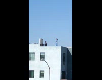 Woman blue outfit short hair roof photoshoot