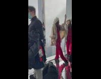 Four people with different photoshoot at the glass building