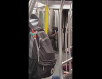 Collab Subway Creatures - Man on Subway Brushes Hair with Blue Comb