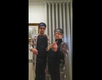 Elderly woman and son pretend to catch phone with chopsticks